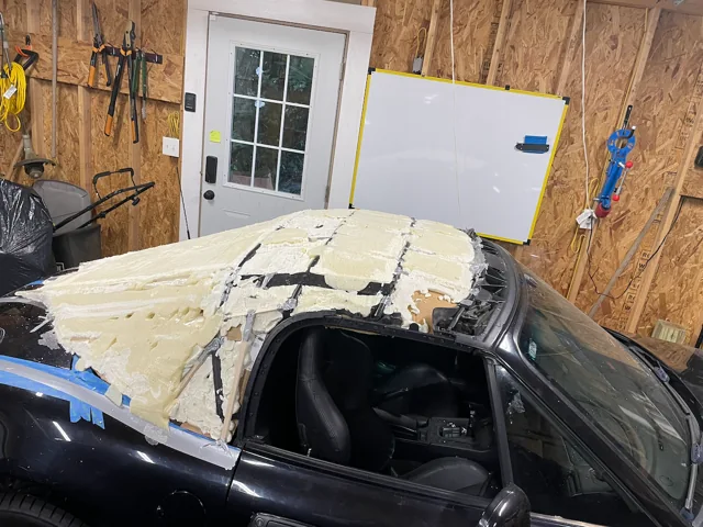 Close view of shaped foam over the original Z3 roof structure, with the roof guides and window opening visible.