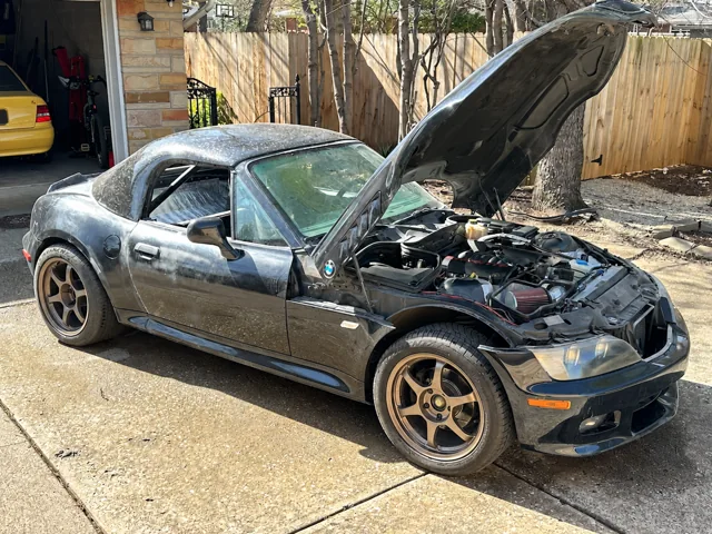 The Z3 outside with its hood raised over the LS1 engine.