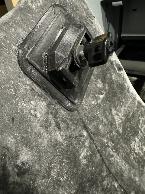 Close-up of the hardtop mounting hardware and carbon surface.